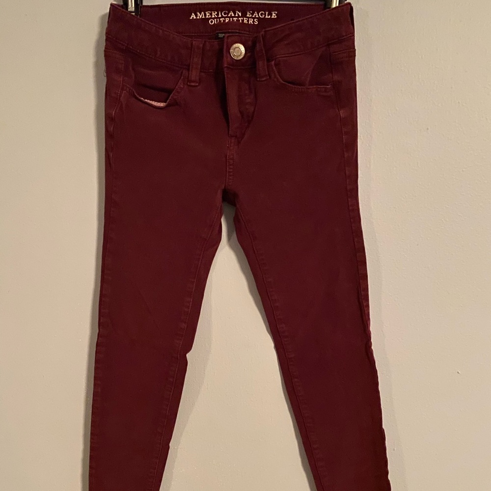 AE Outfitters maroon soft stretch jeans.